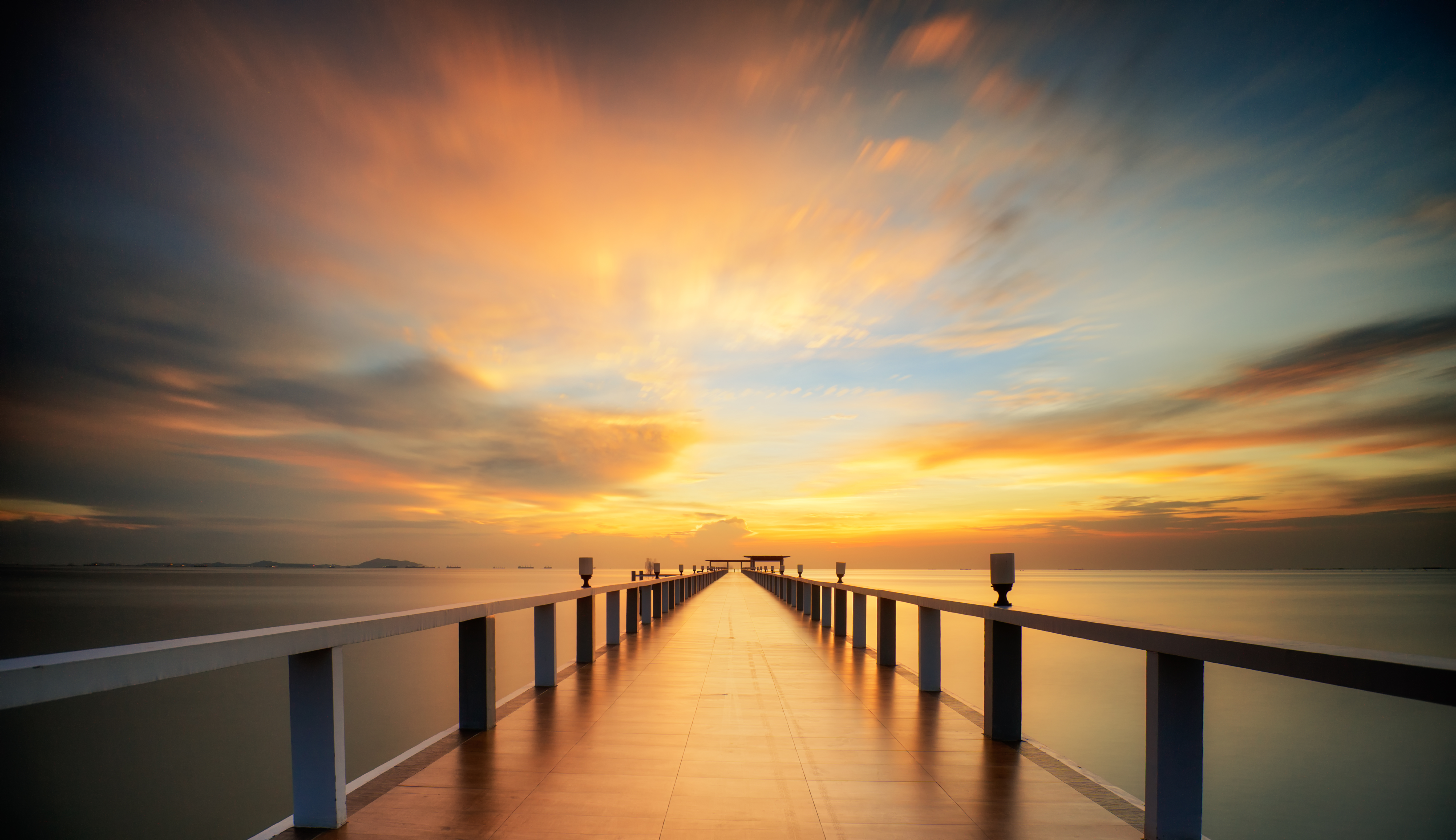 wooded-bridge-by-the-sea-with-sunset-sky(1).jpg